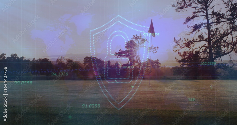 Fototapeta premium Displaying shield showing padlock over grassy field at sunset, with flag and world map numeric data