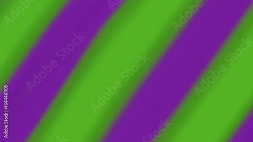 Diagonal stripes of purple and green create a blurred, abstract pattern.