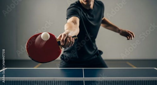 Player serving ping pong ball in minimalist indoor court, low angle, sharp focus on paddle and ball, no visible face