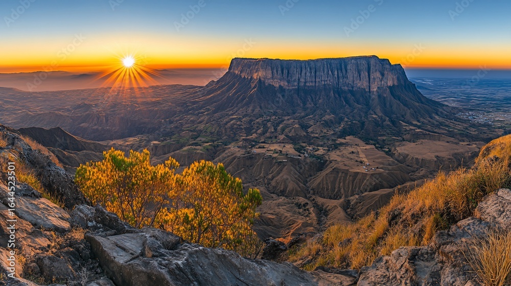 Obraz premium Majestic sunrise over a vast mountain range. Dramatic vista from a high peak