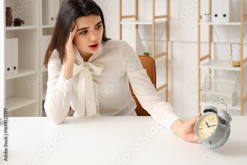 Shocked businesswoman with ...