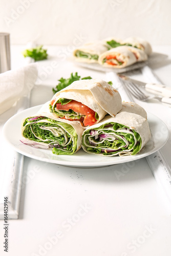 Plate of tasty lavash rolls...
