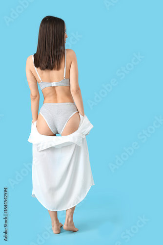 Slim young woman in underwe...