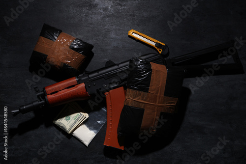 Drug packages with gun, mon...