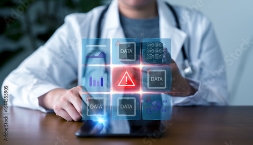 Healthcare cybersecurity, data protection, and digital health technology concepts. Doctor using tablet with holographic interface showing warning alert and medical data icons.