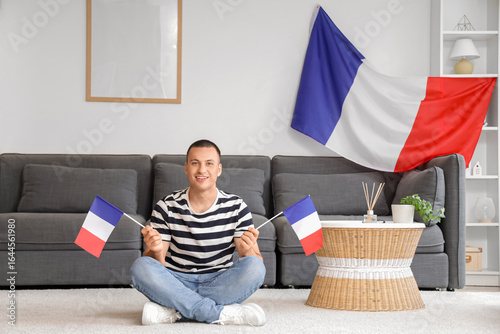 Young man with flags of Fra...