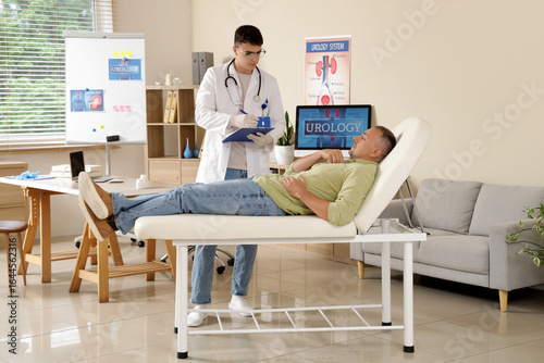Young urologist working wit...