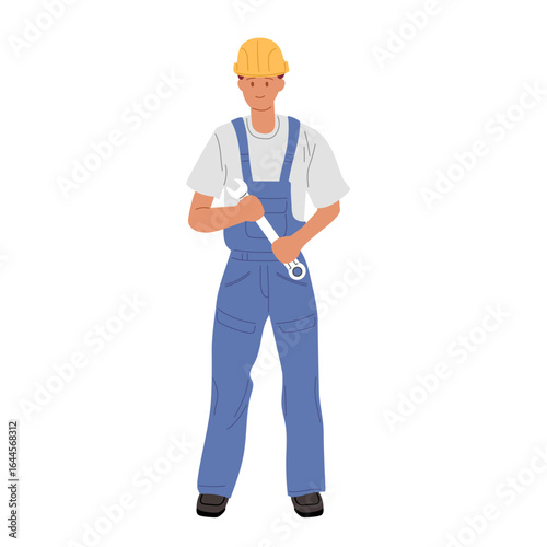 Construction worker in uniform standing with tool in hand at a worksite