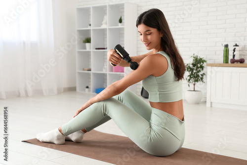 Sporty young woman using pe...