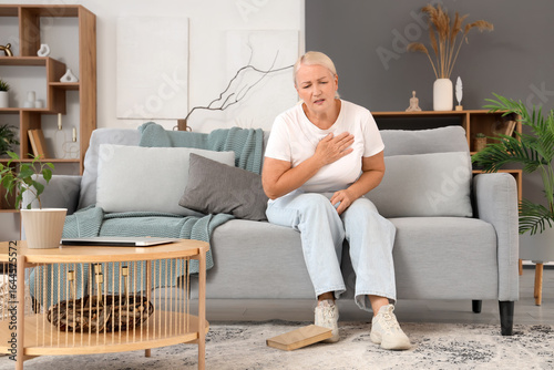 Mature woman having heart a...