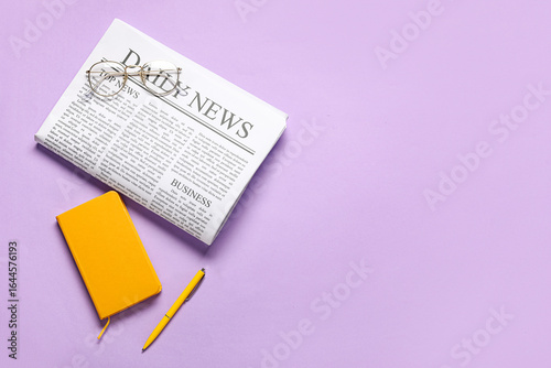 Daily newspaper with glasse...