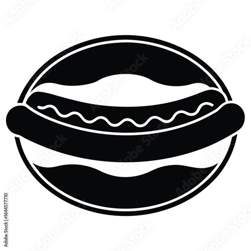 Black hot dog in bun with wavy sauce sausage condiment