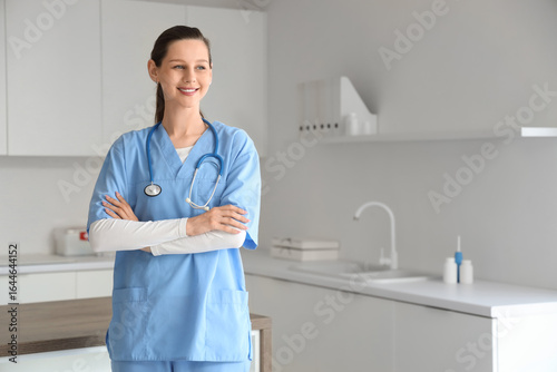 Portrait of female medical intern in clinic
