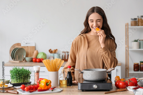 Happy young woman enjoying ...