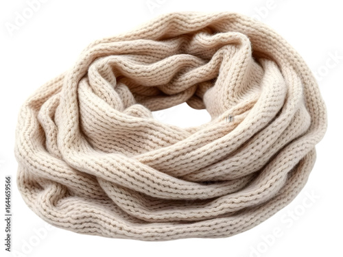 Soft knitted scarf in beige color, folded loosely, isolated on white background