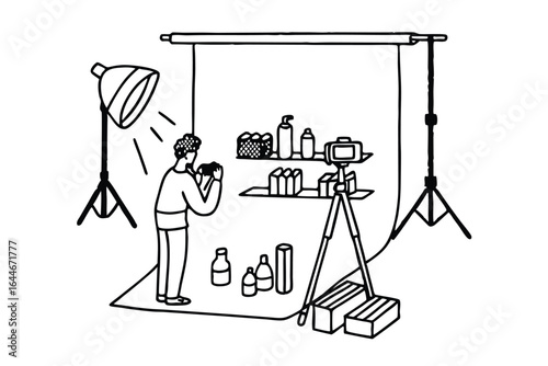 Illustration of a photography studio setup with lighting and artwork