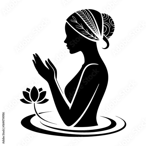 Woman praying with lotus flower silhouette