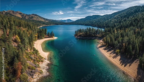 Panoramic aerial view of a serene mountain lake, showcasing crystal-clear turquoise water, sandy beaches nestled between evergreen forests under a vibrant blue sky