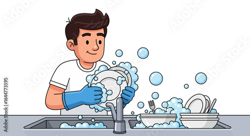 Man happily washing dishes in a sink full of soapy water, with plates and cutlery visible