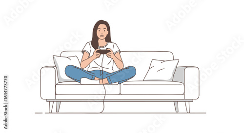 Serene young woman engrossed in video game, sitting cross-legged on sofa, isolated on white. Suitable for illustrating leisure, gaming, or stay-at-home lifestyle concepts.