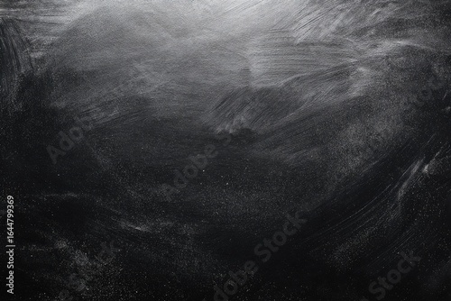Dark gray surface with light gray brushstrokes