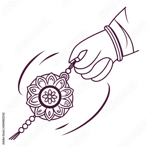 A hand wearing a bracelet ties a rakhi with a floral design and beads to a wrist symbolizing a brother sister bond and indian festival
