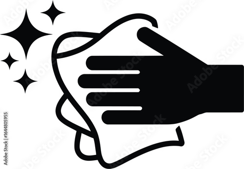 Hand wiping a surface with a cloth creating sparkling clean effect