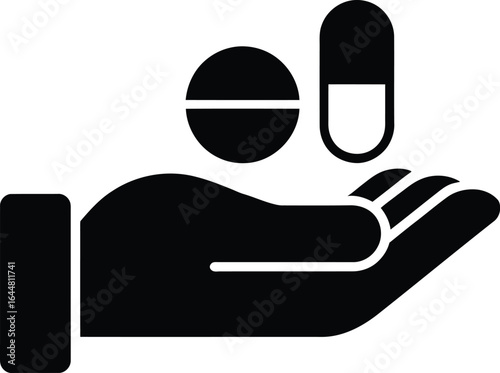 Hand holding pills and capsule representing healthcare and medication concept