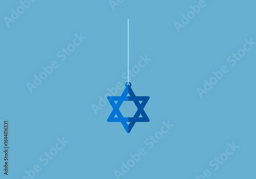 A simple blue Star of David ornament hanging from a string, symbolizing Jewish faith and cultural heritage on a clean background.