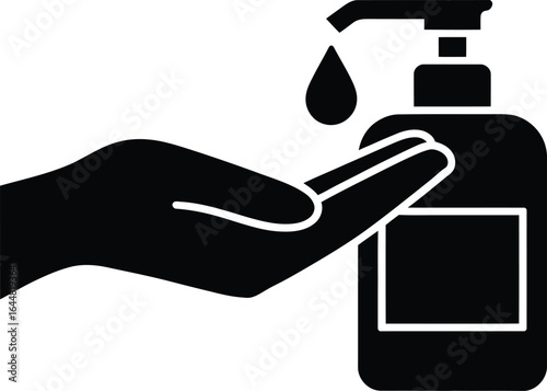 Hand sanitizer dispenser with liquid drop falling onto open palm