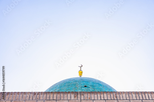 crescent moon on top of a mosque