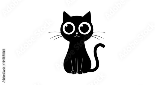 A black cat with large eyes sits and stares forward, its tail curled to the side.