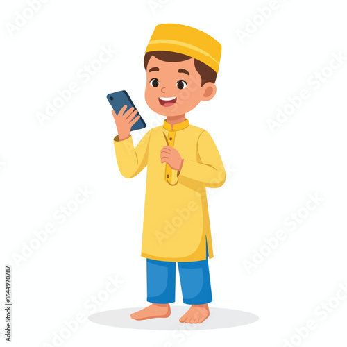 Happy young boy in traditional Muslim clothing using a smartphone.