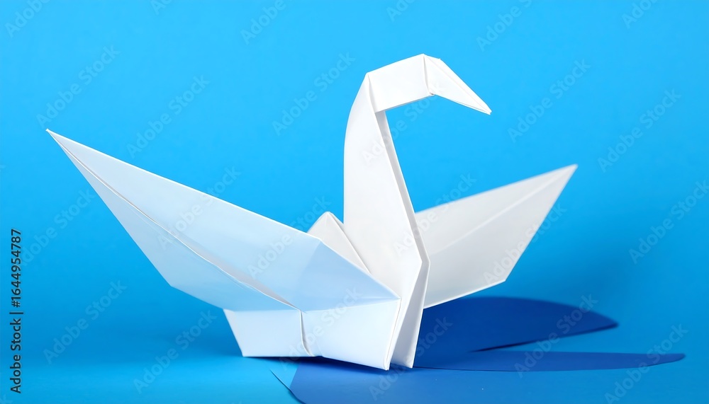 Naklejka premium Elegant Origami Swan on Blue Background