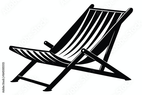 Solitary black beach chair offers relaxing comfort with its striped design 
