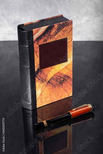 Branded fountain pen near the box. Gift set. Selective focus. Office interior.