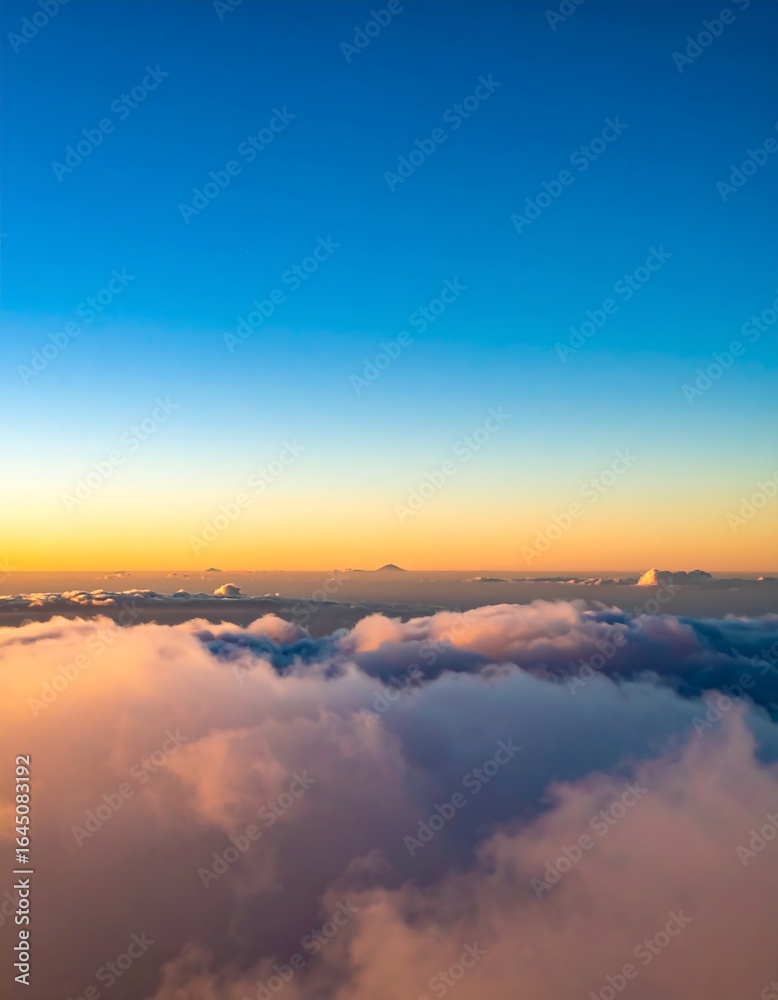 Fototapeta premium Sunrise view from above the clouds, showcasing a vibrant, colorful sky