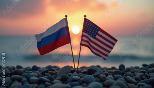 Russian and American flags on pebbles at sunset, symbolizing partnership and hope