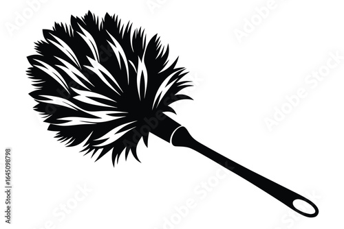 A black feather duster cleaning tool stands out in sharp contrast over white space