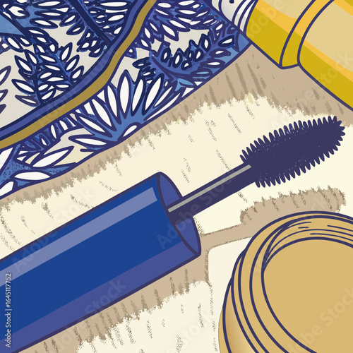 Blue mascara brush and applicator placed beside patterned cloth.
