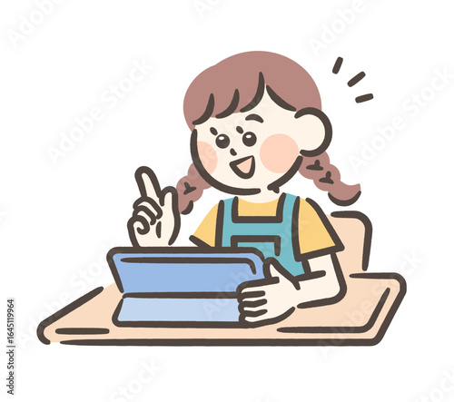 A girl studying on a tablet at school