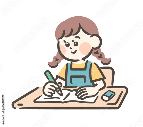 Girl writing in a notebook at a desk