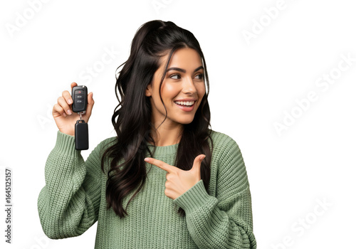 Happy woman holding and pointing to car keys isolated on a transparent background

