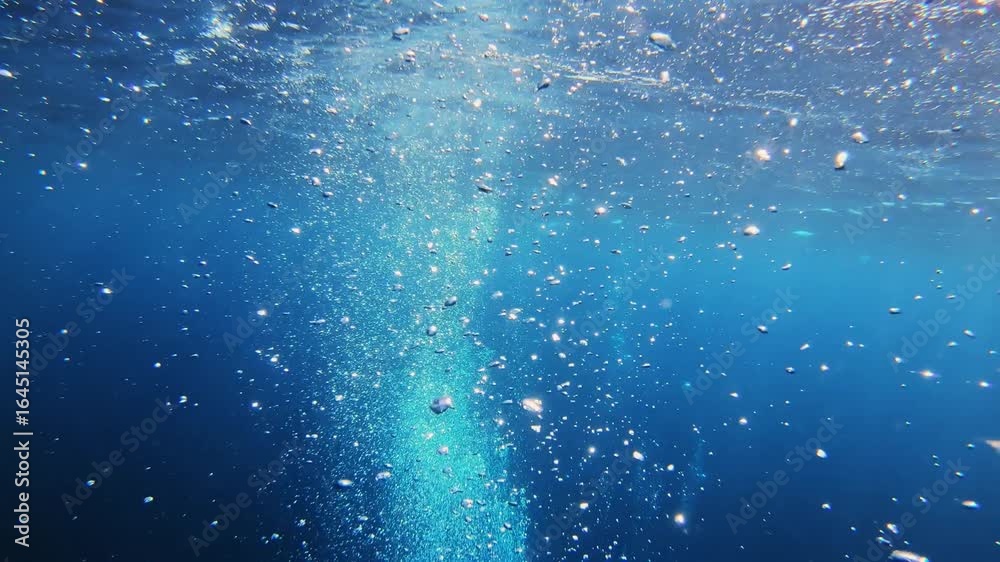 4K Underwater Air Bubbles Rising to Surface in Deep Blue Ocean 4K Underwater Air Bubbles Rising to Surface in Deep Blue Ocean
