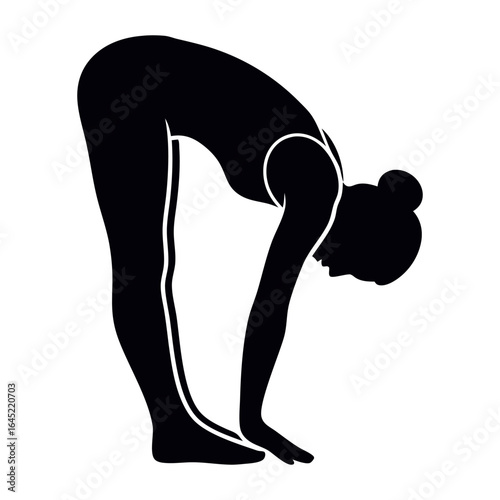 Silhouette of a woman performing a standing forward bend yoga pose