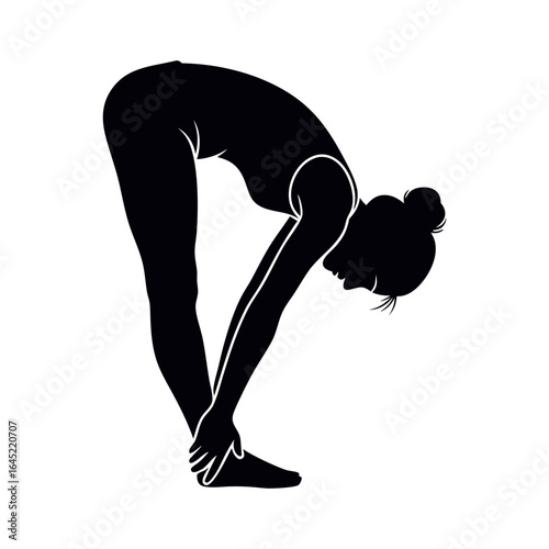 Silhouette of a woman performing a forward fold yoga pose