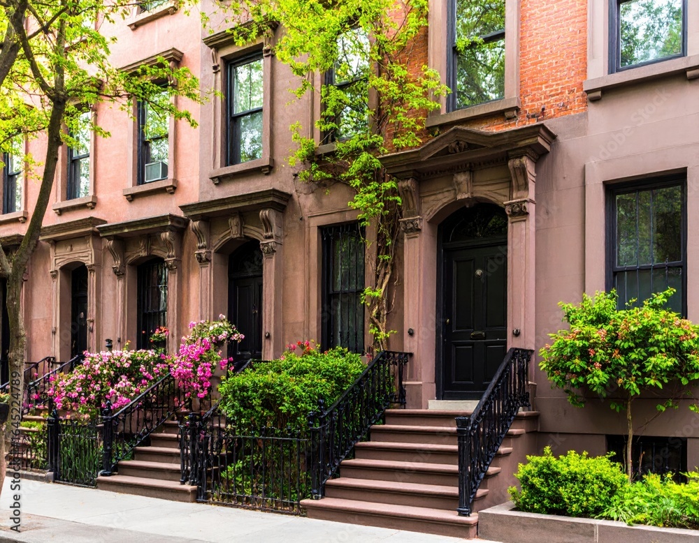 Fototapeta premium Elegant brownstones showing spring colors in an upscale neighborhood