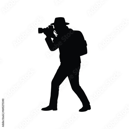 Silhouette of a cameraman with a vintage camera capturing a moment