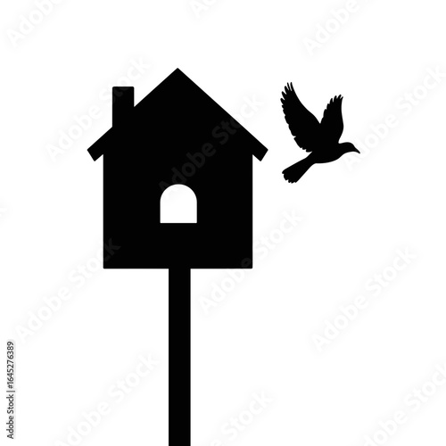Silhouette of bird flying near birdhouse, wildlife conservation and protection