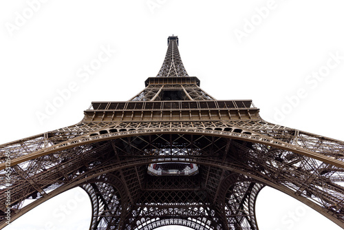 View of the Eiffel Tower's wrought-iron latticework rises boldly against the stark white sky, its intricate design a testament to architectural ingenuity, Paris, ÃŽle-de-France, France.